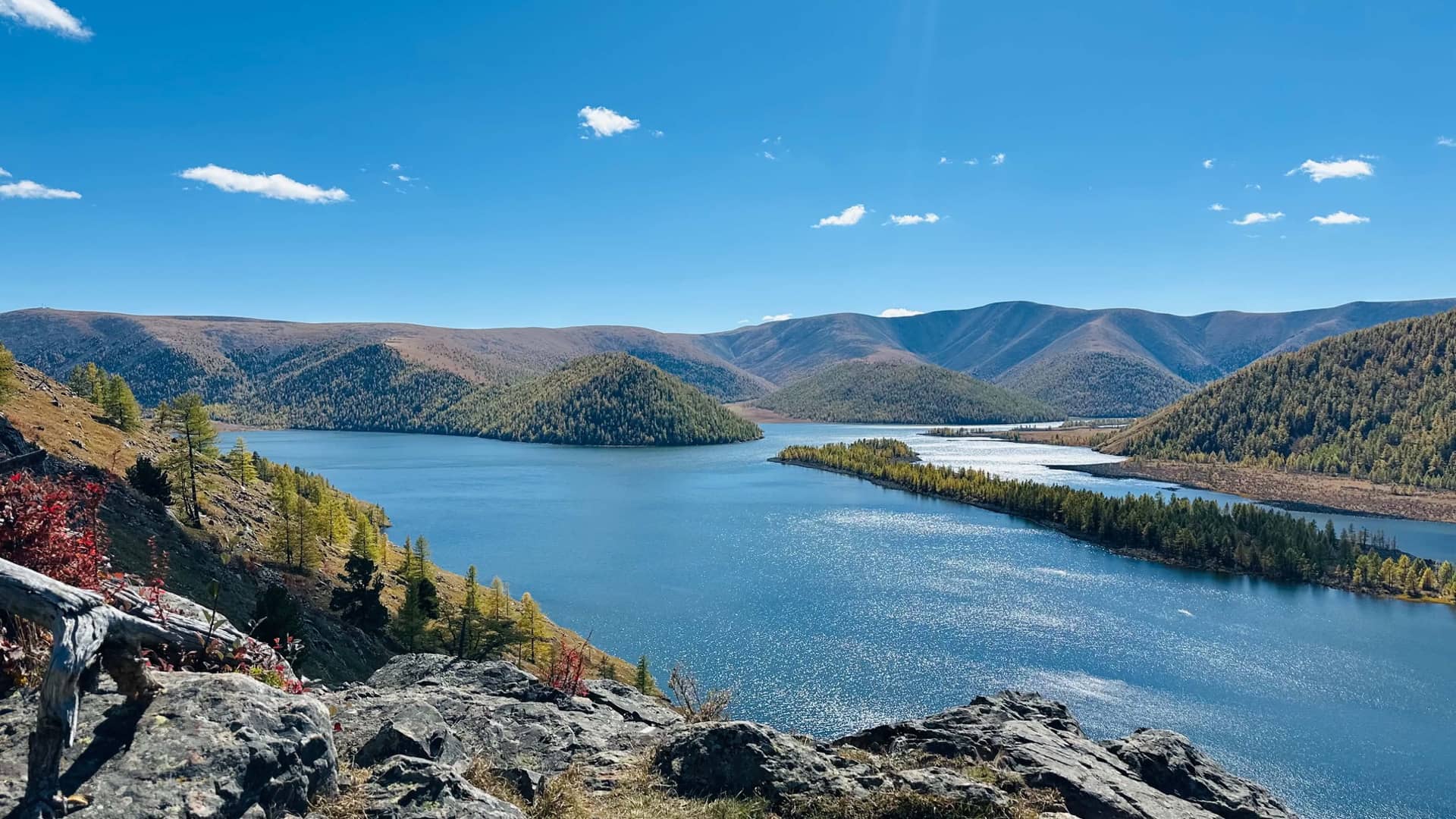 One of the Eight Lakes and its wooded islands seen from the ridge above