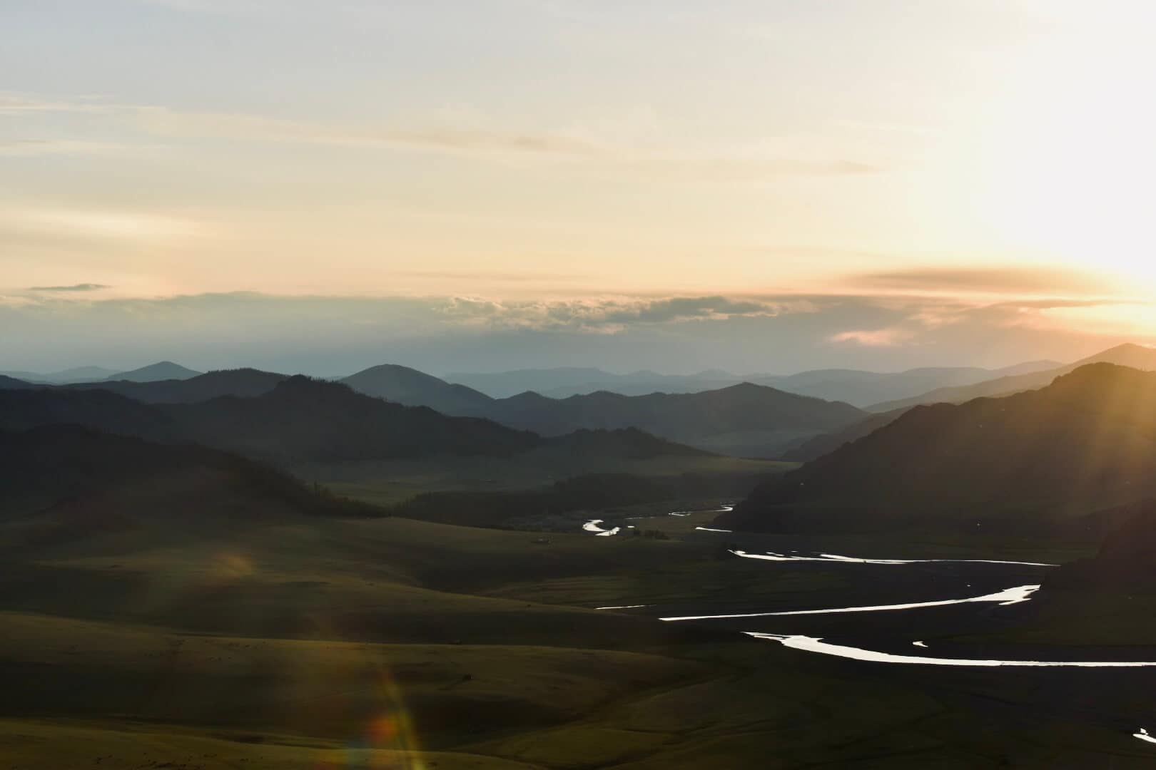Layered hills at sunset