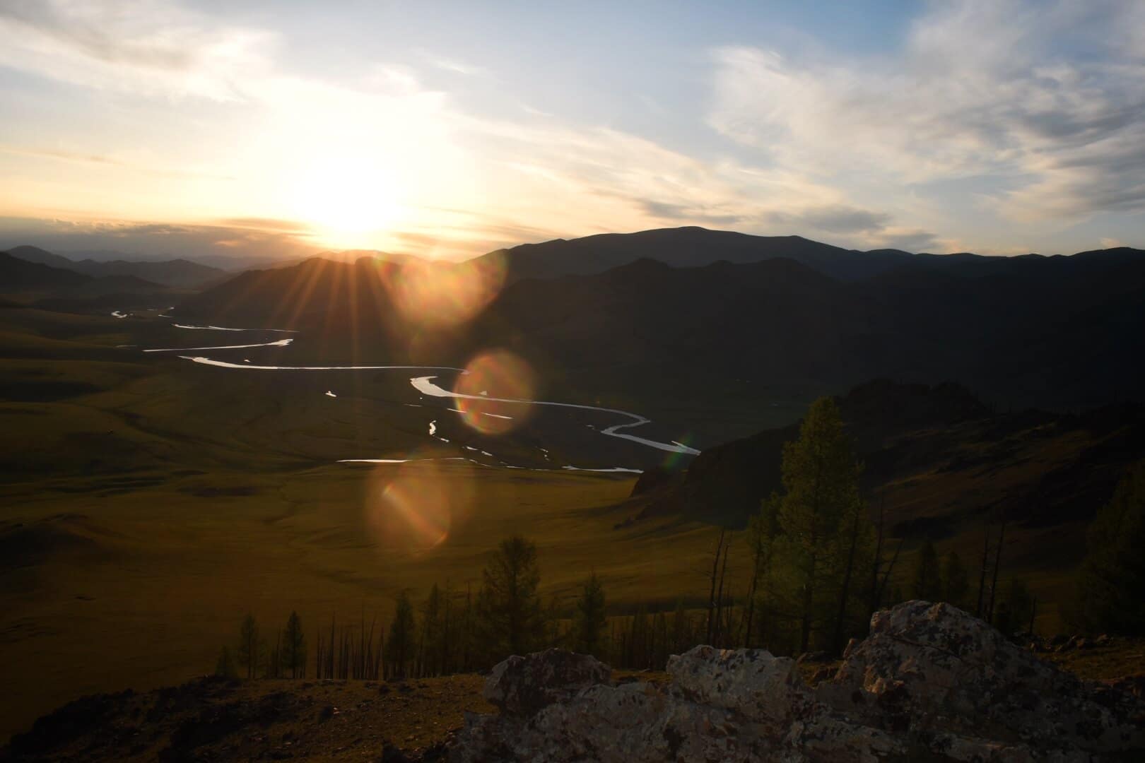 Mountain sunset above a winding river