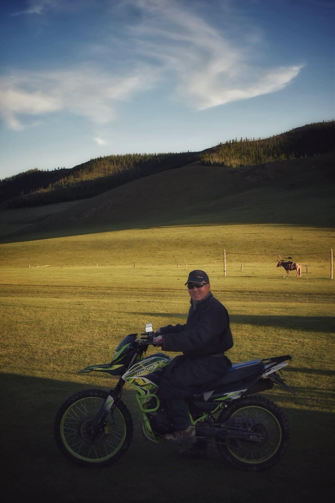 Suma on a motorbike in the open field