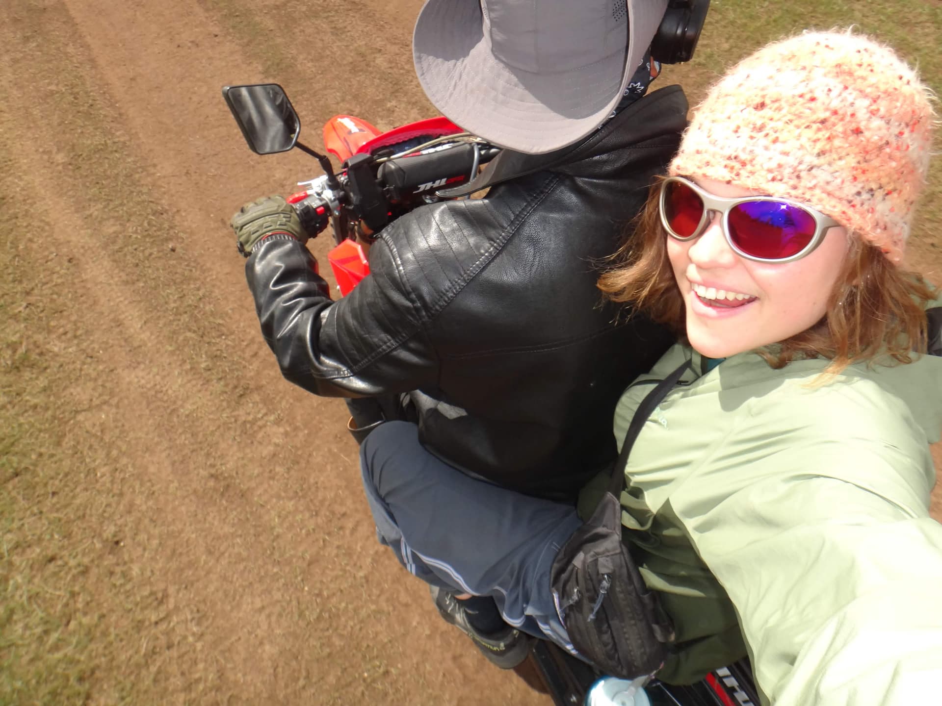 Milou travelling by motorbike through the Mongolian steppe