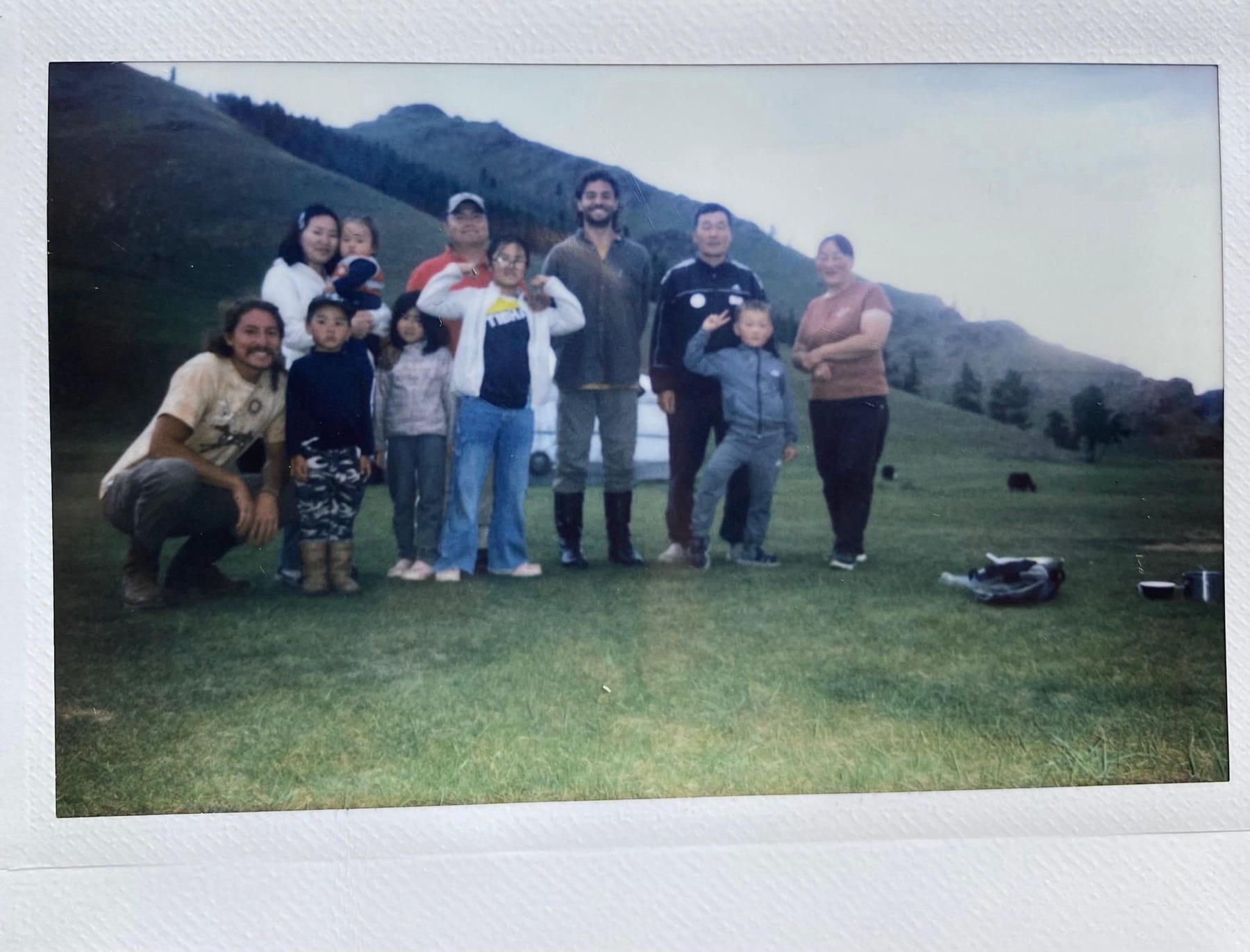 Robert Zaher with the nomadic host family outside a ger
